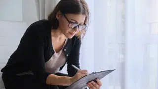 social worker making notesvalerii honcharuk adobestock 302389524