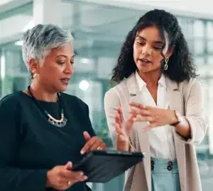 two women having a stand up meeting at work fremtonclay peopleimagescom adobe stock 1485543296 1