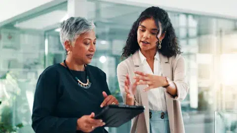 two women having a stand up meeting at work fremtonclay peopleimagescom adobe stock 1485543296 1